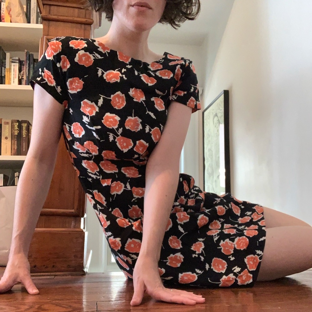 Black low back dress with orange flower print
